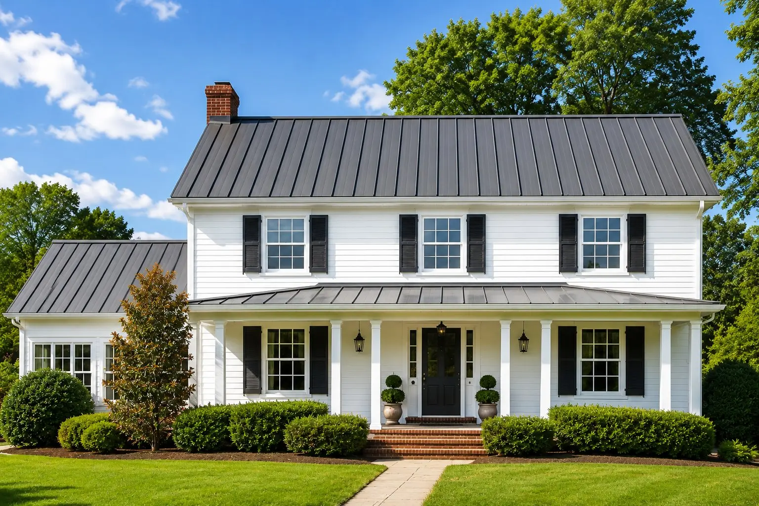 Beautiful standing seam metal roof on a white colonial home in Newark, Ohio
