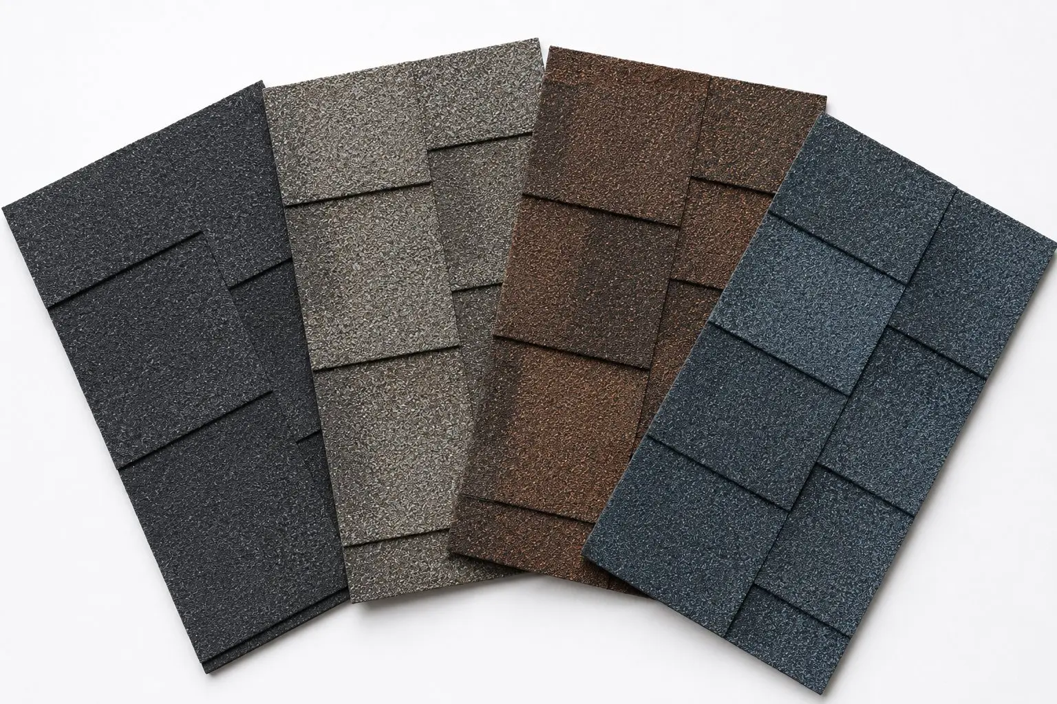 Four architectural asphalt shingle color samples fanned out showing charcoal, weathered wood, brown blend, and slate blue options for Newark Ohio homeowners